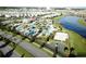 Aerial view of a community featuring a pool, lazy river, basketball and volleyball court at 4907 Romeo Cir, Kissimmee, FL 34746