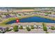 Stunning aerial view of the community, featuring a serene lake and well-maintained landscaping at 4907 Romeo Cir, Kissimmee, FL 34746