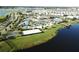 Aerial view of a community featuring a pool, lazy river, basketball and volleyball court at 4907 Romeo Cir, Kissimmee, FL 34746