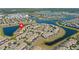 Expansive aerial view of the community featuring multiple lakes, bridges, and lush landscaping at 4907 Romeo Cir, Kissimmee, FL 34746