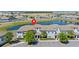 Community aerial view showcasing a stunning lakeside townhome with tile roof at 4907 Romeo Cir, Kissimmee, FL 34746