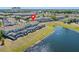 Picturesque aerial view of the condo community, highlighting the surrounding lakes and landscaping at 4907 Romeo Cir, Kissimmee, FL 34746