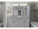 Bathroom featuring a double vanity, granite countertops, and a shower-tub combination at 4907 Romeo Cir, Kissimmee, FL 34746