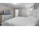 Bright bedroom with queen bed, a TV, and direct access to the ensuite bathroom at 4907 Romeo Cir, Kissimmee, FL 34746