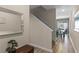 Inviting entryway with tiled floors, a staircase, and a view into the dining room area at 4907 Romeo Cir, Kissimmee, FL 34746