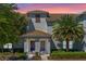 Charming townhome exterior featuring dual front doors and manicured landscaping at 4907 Romeo Cir, Kissimmee, FL 34746