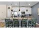 Modern kitchen featuring an island with granite countertops and pendant lighting at 4907 Romeo Cir, Kissimmee, FL 34746