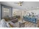 Spacious living area open to the kitchen and dining area, perfect for entertaining at 4907 Romeo Cir, Kissimmee, FL 34746
