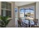 This patio features a dining table, chairs, and a view of the pool in the screened in lanai at 4907 Romeo Cir, Kissimmee, FL 34746