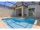 This backyard features a private pool with a screened in lanai and dining table on the patio at 4907 Romeo Cir, Kissimmee, FL 34746