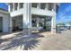 View of the covered pool bar area with outdoor seating and TV at 4907 Romeo Cir, Kissimmee, FL 34746