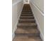Carpeted staircase leading to the upper level, promising comfort and style at 4907 Romeo Cir, Kissimmee, FL 34746