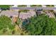 Aerial shot of a home with a screened pool in a landscaped backyard at 5137 Links Ln, Leesburg, FL 34748
