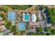 Aerial view of community amenities featuring tennis courts and a community pool at 5137 Links Ln, Leesburg, FL 34748