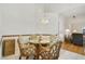 Dining area features a glass top table and views into the living room at 5137 Links Ln, Leesburg, FL 34748