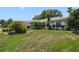 Beautifully maintained lawn and mature landscaping enhance this home's curb appeal at 5137 Links Ln, Leesburg, FL 34748