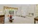 Cozy living room featuring elegant decor, carpet floors, and ample natural light at 5137 Links Ln, Leesburg, FL 34748