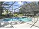Backyard featuring a screened pool with a separate spa and patio at 5137 Links Ln, Leesburg, FL 34748