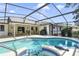 Beautiful swimming pool and patio area with chairs and outdoor grill at 5137 Links Ln, Leesburg, FL 34748