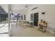 Screened-in porch showcasing patio furniture and views of the landscaped backyard at 5137 Links Ln, Leesburg, FL 34748