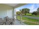 Comfortable balcony seating overlooking the golf course, perfect for relaxing and enjoying the serene views at 7683 Heritage Crossing Way # 202, Reunion, FL 34747