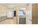 Bathroom with a bathtub and an open door to the bedroom with a queen bed and balcony at 7683 Heritage Crossing Way # 202, Reunion, FL 34747