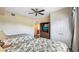 Bedroom with two beds, ceiling fan, TV and closet at 7683 Heritage Crossing Way # 202, Reunion, FL 34747