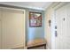 Condo hallway with bench and unit number at 7683 Heritage Crossing Way # 202, Reunion, FL 34747