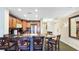 Modern kitchen with granite countertops and ample seating, great for entertaining and casual dining at 7683 Heritage Crossing Way # 202, Reunion, FL 34747