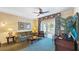 Well-appointed living room featuring a comfortable seating area, and access to a private balcony at 7683 Heritage Crossing Way # 202, Reunion, FL 34747