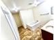 Bright bathroom featuring a soaking tub and large vanity at 7716 Park Hill Ave, Leesburg, FL 34748