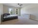 Comfortable bedroom with a window and ample space for storage at 7716 Park Hill Ave, Leesburg, FL 34748