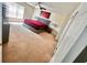 Carpeted bedroom filled with natural light from bright window at 7716 Park Hill Ave, Leesburg, FL 34748