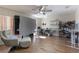 A bonus room featuring a hardwood floor and custom shelving at 7716 Park Hill Ave, Leesburg, FL 34748