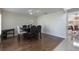 Formal dining room with hardwood floors, stylish seating, and adjacent access to the main living areas at 7716 Park Hill Ave, Leesburg, FL 34748