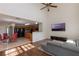 Inviting living room with an open floor plan, eat-in kitchen, hardwood floors, and neutral décor at 7716 Park Hill Ave, Leesburg, FL 34748