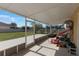 Enclosed patio showcasing a view of the fenced backyard at 7716 Park Hill Ave, Leesburg, FL 34748