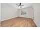 Bright bedroom with wood floors and a window providing natural light at 8612 Brookvale Dr, Windermere, FL 34786