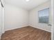 Bedroom featuring wood floors, a window with blinds, and a closet at 8612 Brookvale Dr, Windermere, FL 34786