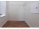 Walk-in closet with wire shelving and wood floors, providing ample storage at 8612 Brookvale Dr, Windermere, FL 34786