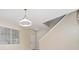 Bright entryway featuring a modern light fixture, staircase, and neutral walls at 8612 Brookvale Dr, Windermere, FL 34786