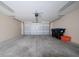 Spacious two-car garage with white brick walls, lighting, and an automatic door at 8612 Brookvale Dr, Windermere, FL 34786