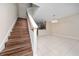 Open-concept living room with tile floors and view to the kitchen with granite countertops at 8612 Brookvale Dr, Windermere, FL 34786