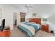 Bright bedroom featuring a window, ceiling fan, carpet flooring and walk-in closet at 8923 Legacy Ct # 19-102, Kissimmee, FL 34747