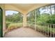A screened patio shows a view of the surrounding foliage and trees at 8923 Legacy Ct # 19-102, Kissimmee, FL 34747