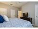 Bright bedroom with a comfortable bed, complemented by neutral walls and a ceiling fan at 8971 Candy Palm Rd, Kissimmee, FL 34747