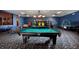 Spacious game room featuring a pool table, ping pong, air hockey, and arcade games, all illuminated by modern light fixtures at 8971 Candy Palm Rd, Kissimmee, FL 34747