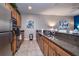 Well-equipped kitchen with stainless steel appliances and dark countertops at 8971 Candy Palm Rd, Kissimmee, FL 34747