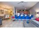 Spacious living area featuring a breakfast bar, dining area, and comfortable seating at 8971 Candy Palm Rd, Kissimmee, FL 34747