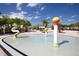 Interactive splash pad with colorful water features, perfect for Gathering fun and cooling off on warm days at 8971 Candy Palm Rd, Kissimmee, FL 34747